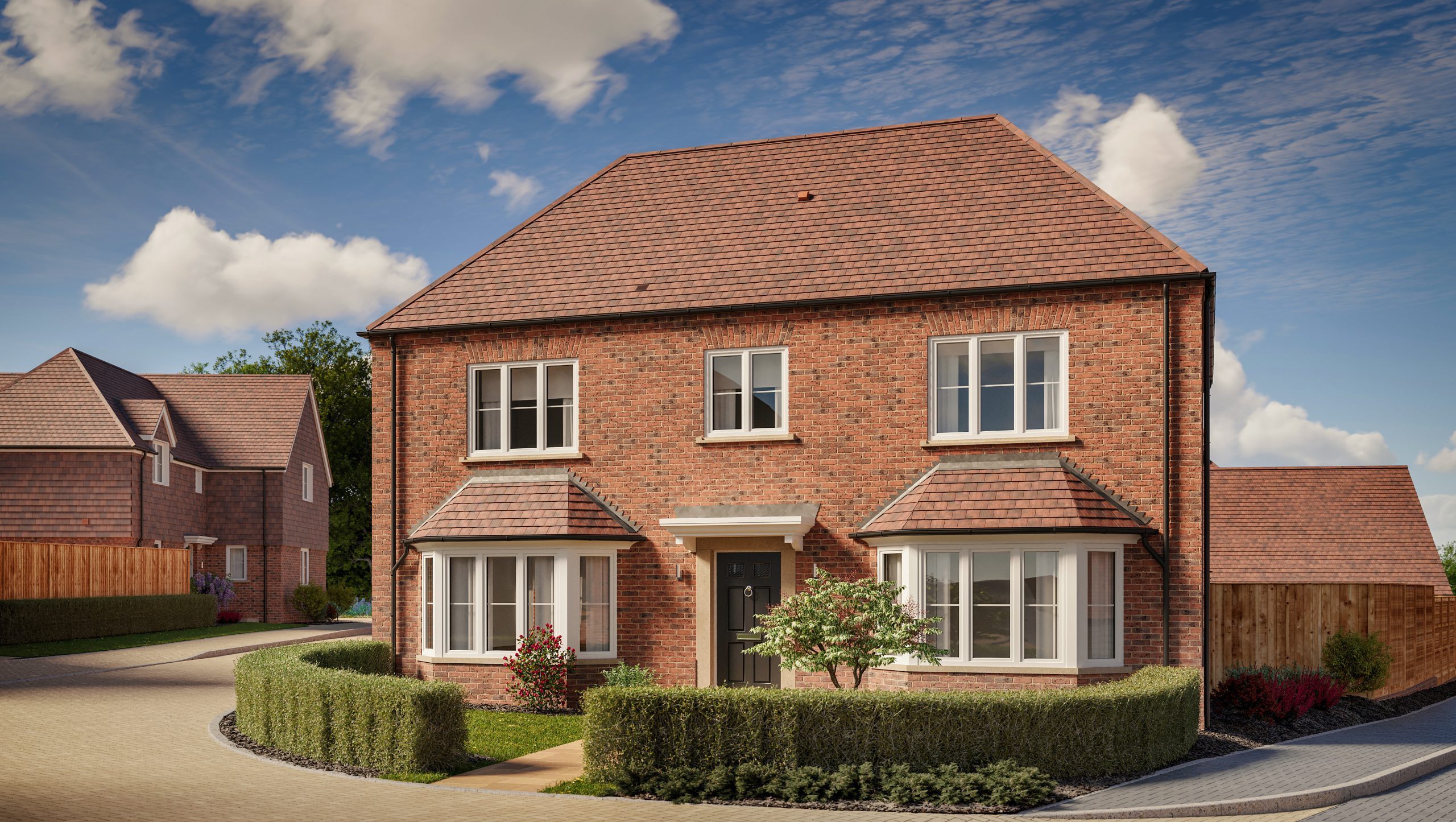 New two-story brick house with a tiled roof, windows with white frames, and a landscaped front garden.